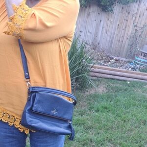 Kate Spade New York Cobble Hill tassel crossbody bag in a navy blue